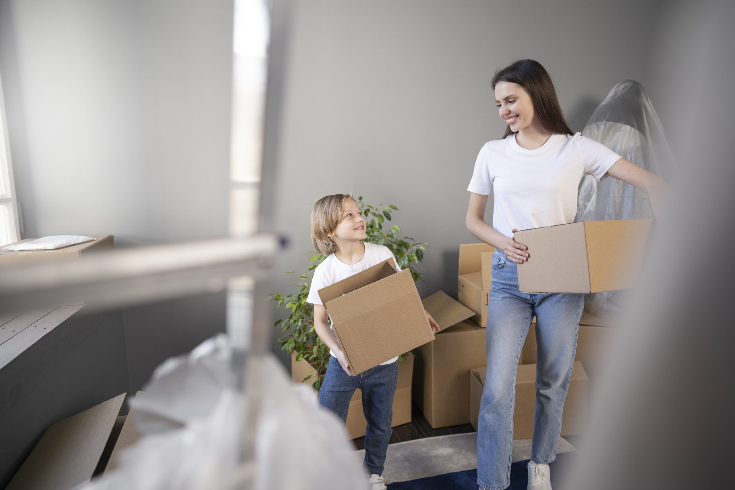young family moving into new home scaled